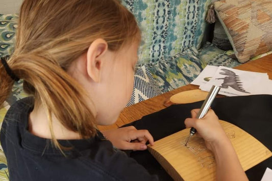 Kids use engraving pen