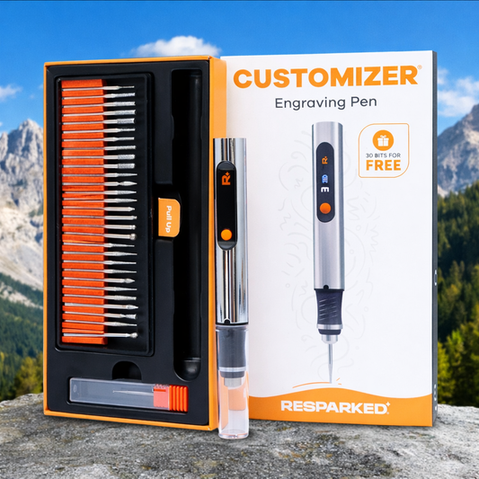 Engraving pen set with accessories on a mountainous background
