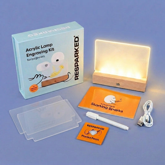 Acrylic lamp engraving kit with components on a blue background